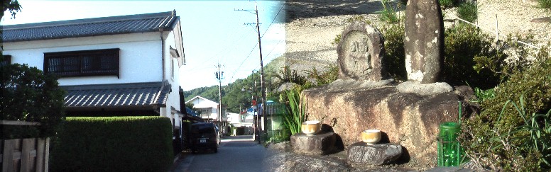 本陣跡横の道祖神と中山道の町並み。