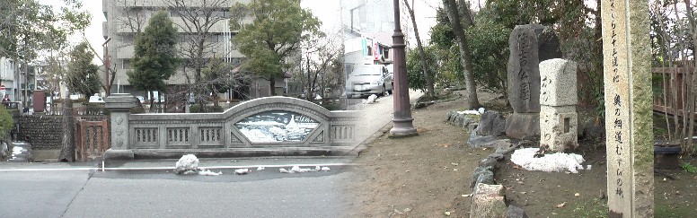 上記道標前から写す：後ろの建物は「奥の細道むすびの地」記念館（市総合福祉会館内）と住吉公園の一部。