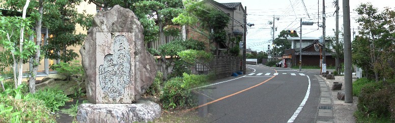 ウィキメディア・コモンズ経由で・紙本著色『行く春図』（左隻）川合玉堂筆 六曲屏風 重要文化財 川合玉堂 川合玉堂生誕の地、記念碑前の街道。木曽川図書館前に建っています。 川合玉堂生誕の地